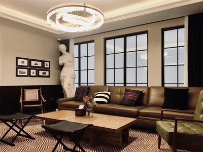 A living room with a leather sofa and wooden coffee table, featuring industrial design elements such as exposed metal beams a