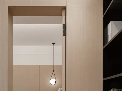Minimalist bedroom with wooden furniture and white walls.