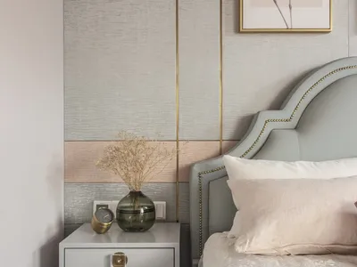 Modern bedroom featuring a brown upholstered bed and wooden nightstand.