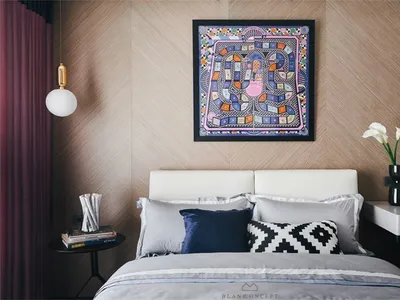 Minimalist bedroom with a white bed and colorful abstract painting above it.