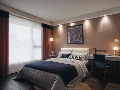 一間現代臥室，配有紋理木板牆的床、藍色寢具，以及附椅子的木質書桌和檯燈。