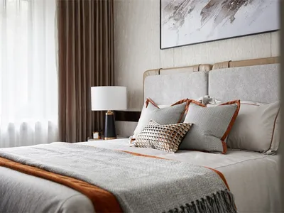 Modern bedroom with a bed featuring fabric and leather elements.
