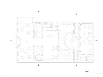 Floor plan of a coffee shop with tables, chairs, and a central open area.
