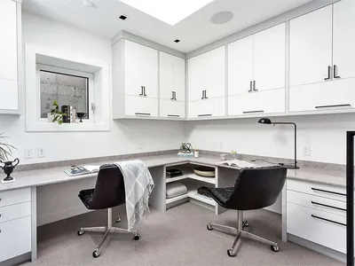 A modern home office featuring concrete and steel finishes.