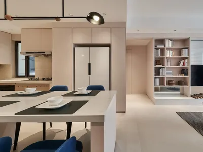 Modern minimalist living room with white walls, wooden floors, and a combination of soft and hard materials.