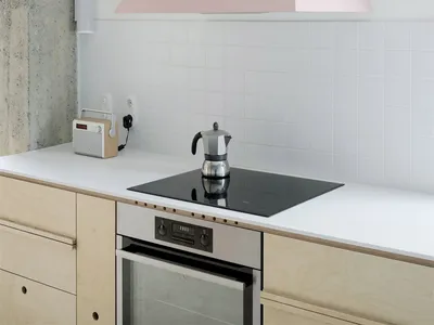 Modern minimalist kitchen featuring a sleek, contemporary design with a white countertop.