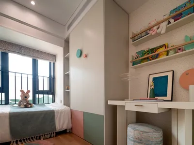 A modern children's bedroom featuring colorful furniture and decorative elements.