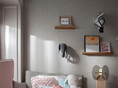 A minimalist bedroom with a bed, soft pink blanket, and decorative items