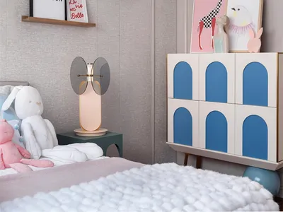 A modern children's bedroom with textured paneling and wooden furniture.