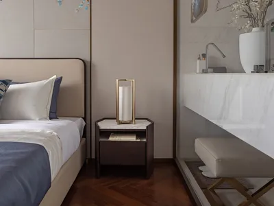 Modern minimalist bedroom featuring marble surfaces and textile elements, showcasing contemporary design.