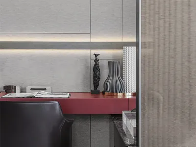 A modern home office featuring a sleek metallic red desk in a minimalist design setting.