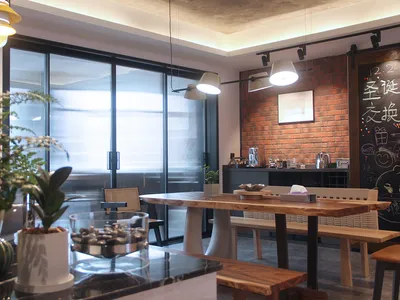 Modern cafe interior with wooden table, concrete floors, and brick wall