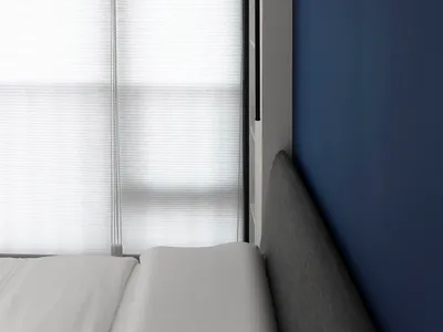Modern minimalist bedroom featuring window blinds.