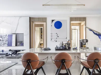 Modern kitchen bar featuring a marble countertop