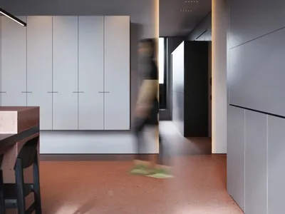 Efficient modern kitchen featuring minimalist design with concrete finishes.