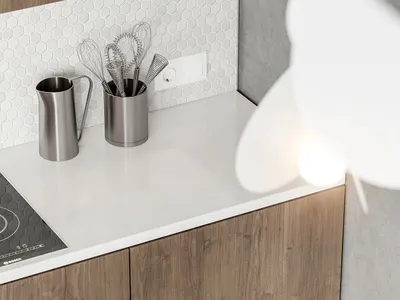 A modern kitchen featuring metallic containers and concrete countertops against a wooden cabinet background.