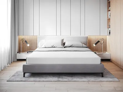 A minimalist bedroom with a gray bed and wooden accents