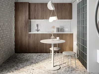 A modern minimalist kitchen with wooden cabinets, white countertops, and pendant lighting.