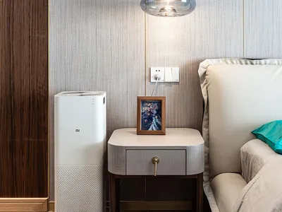 A modern bedroom featuring decorative elements made of wood and textile materials.