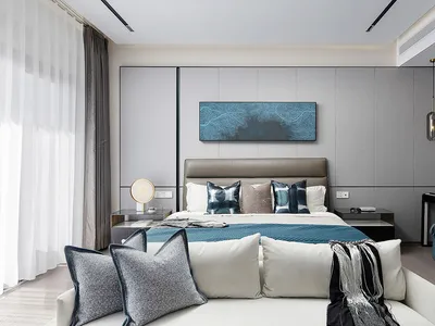 A contemporary bedroom with a bed, nightstands, and decorative pillows.
