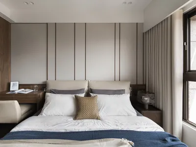 Modern bedroom featuring fabric, wood, and metal elements.