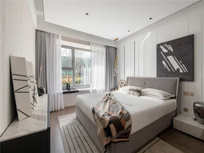 Modern minimalist bedroom featuring a grey upholstered bed with a geometric abstract painting above, white curtains, and a st