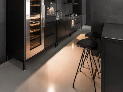 A sleek, contemporary kitchen with metallic cabinets and stainless steel appliances.