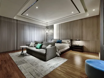 Modern minimalist bedroom featuring wooden furniture and fabric upholstery.