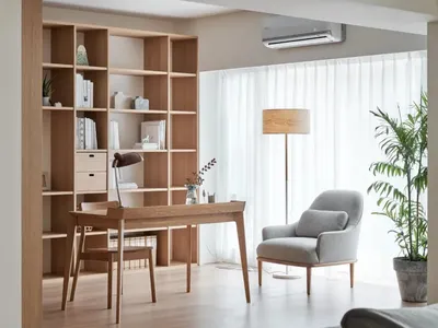 A modern Scandinavian home office with minimalist design, wooden desk, and glass bookshelf.