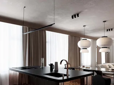 Modern kitchen featuring metallic counter with black countertops, sink, and faucet.