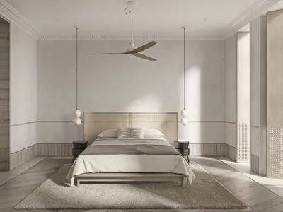Minimalist bedroom featuring a wooden platform bed, white bedding, and hanging pendant lights.