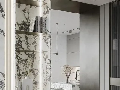 Modern kitchen featuring white and gray marble countertops and backsplash with metallic accents.