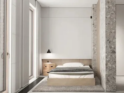 Modern minimalist bedroom featuring a wooden bed frame, concrete floor, and glass window.