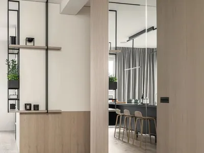 Modern kitchen with wooden cabinets and glass shelves