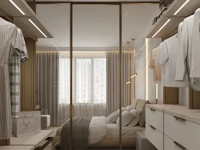 現代臥室設有玻璃隔間、木質地板及布料家具，位於工作室公寓內。