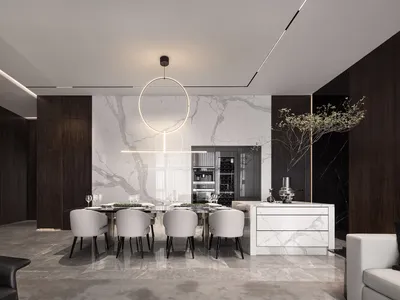 Modern, minimalist kitchen space with marble countertops, wood cabinetry, and stainless steel appliances.
