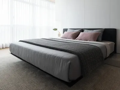 一間現代簡約臥室，擁有木質天花板、灰色寢具與白色牆面。