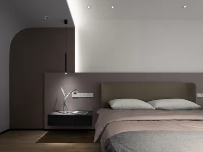 A minimalist bedroom with a sleek bed and floating nightstand.