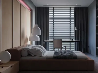 A modern bedroom featuring comfortable furniture, clean lines, and minimalistic decor.