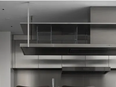 現代工業風格廚房，搭配金屬家電與檯面。