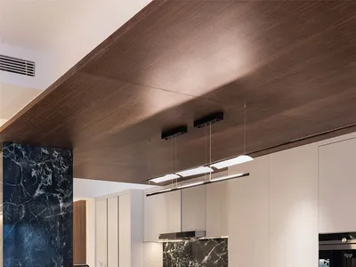 Modern kitchen with marble countertops and concrete floor