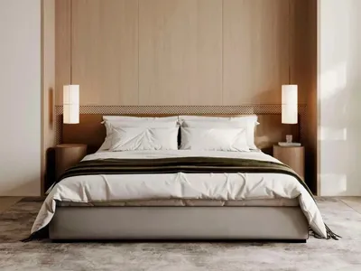 A minimalist bedroom with a white bed featuring a wooden headboard and two pendant lights.