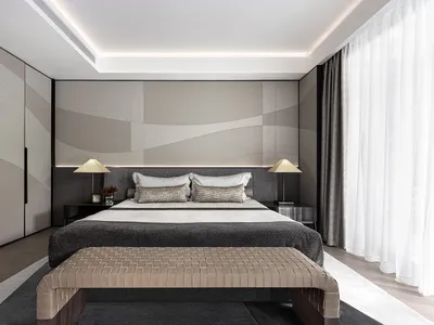 Modern minimalist bedroom with fabric, leather, and metal accents