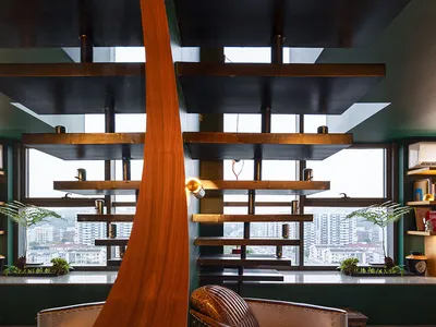 Modern, industrial-style cafe interior featuring wooden and concrete materials.