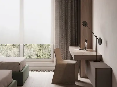 A minimalist bedroom featuring wood furniture, large windows with curtains, and a floating desk with a laptop.