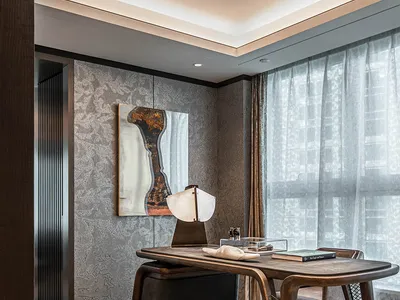 Modern home office featuring a wooden desk with a minimalist design.