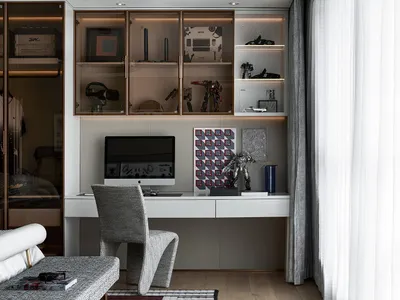 A minimalist home office with a sleek desk, modern chair, and organized shelf.