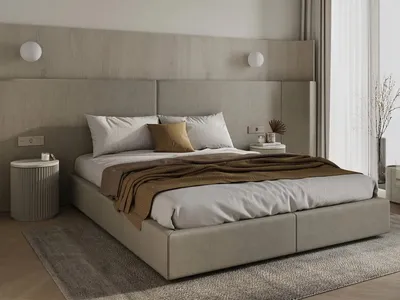 A minimalist bedroom with a fabric upholstered bed, white walls, and a large window with light-colored curtains.