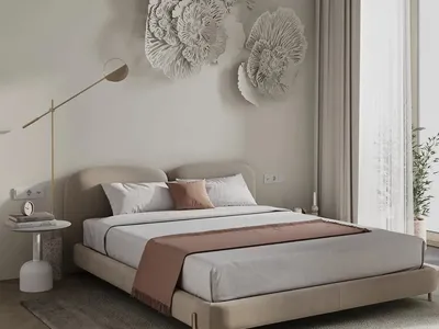 A minimalist bedroom featuring neutral fabrics and white walls.