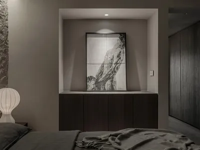 A modern, minimalist bedroom with dark wood furniture, gray bedding, and a textured wall.